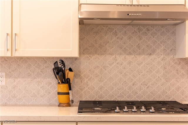 kitchen featuring white cabinets and stainless steel gas cooktop