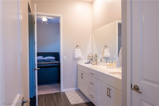 bathroom with ceiling fan, hardwood / wood-style floors, and vanity