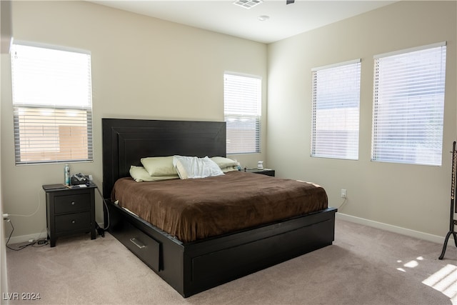 bedroom with light colored carpet