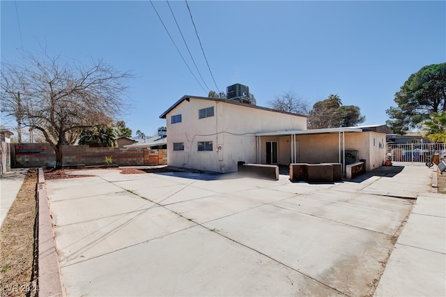 view of side of home featuring a patio area and central air condition unit