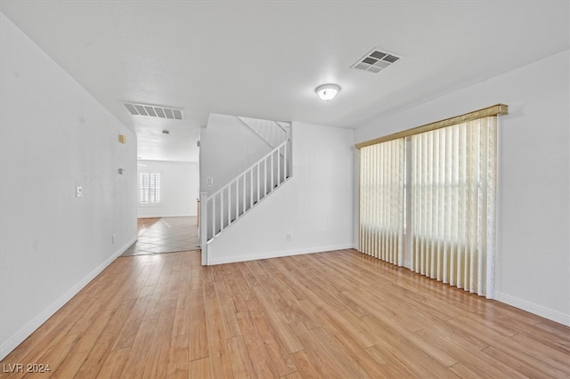 spare room featuring light hardwood / wood-style floors