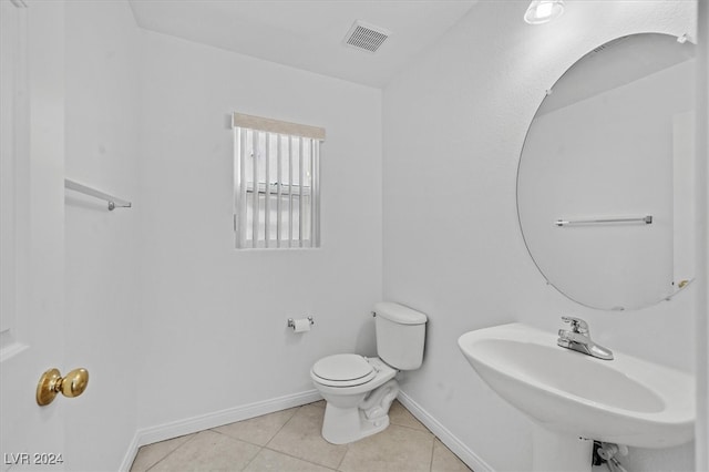 bathroom featuring tile patterned floors, sink, and toilet