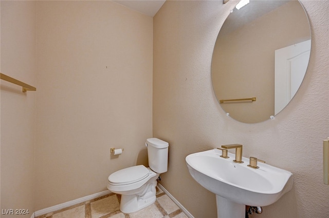 bathroom with toilet and sink