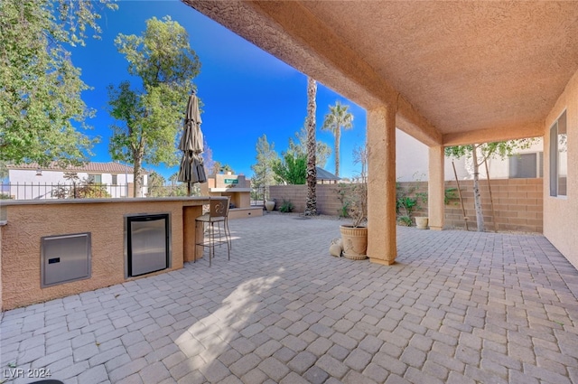 view of patio / terrace featuring exterior bar