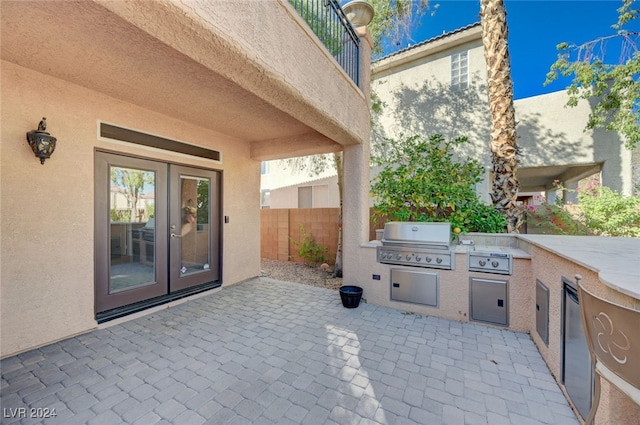 view of patio featuring a grill and exterior kitchen