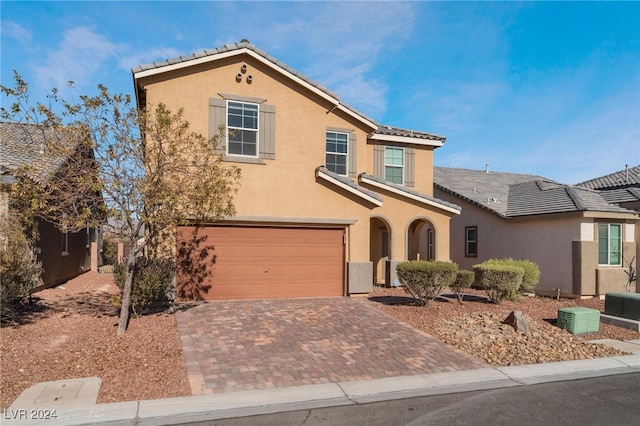 view of front of property featuring a garage