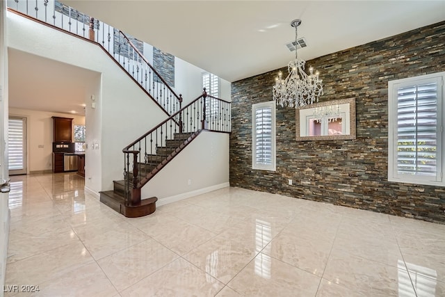 foyer featuring a notable chandelier and plenty of natural light