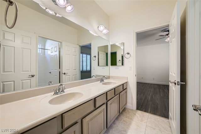 bathroom featuring hardwood / wood-style floors, vanity, and ceiling fan