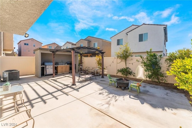 view of patio with a fire pit, area for grilling, cooling unit, and a pergola