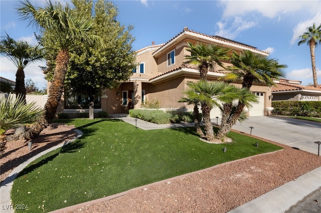 view of front facade with a front yard and a garage