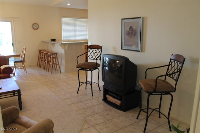 sitting room featuring light tile patterned flooring