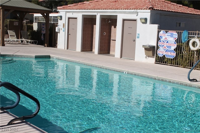 view of swimming pool with a gazebo