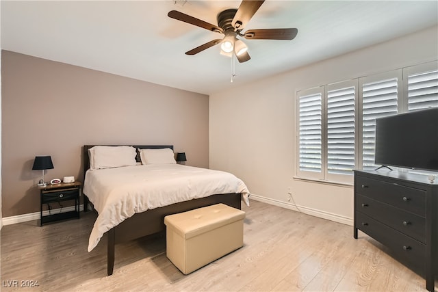 bedroom featuring ceiling fan and light hardwood / wood-style flooring