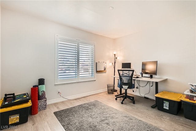 office space with light wood-type flooring