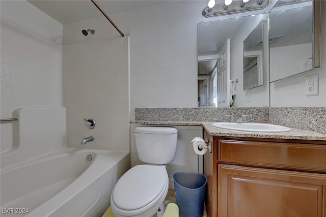 full bathroom featuring toilet, vanity, and tub / shower combination