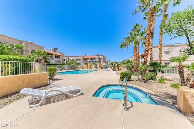 view of pool featuring a community hot tub