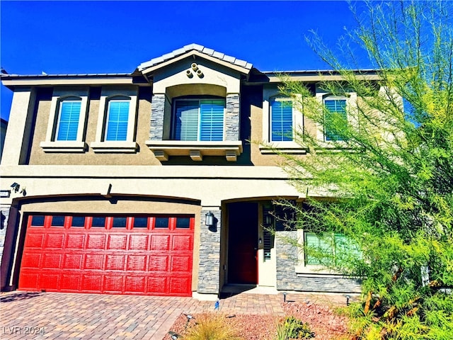 view of front of home with a garage