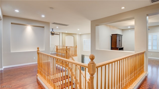 corridor featuring hardwood / wood-style floors