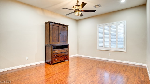 unfurnished bedroom featuring light hardwood / wood-style floors and ceiling fan