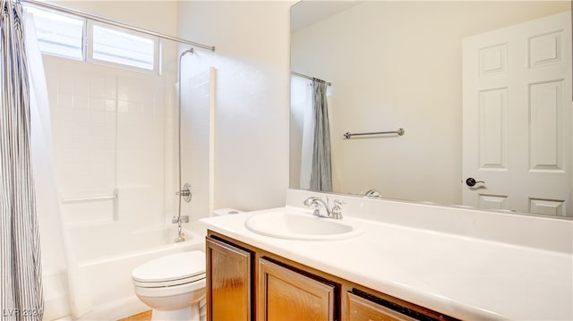 full bathroom featuring shower / bath combo with shower curtain, vanity, and toilet