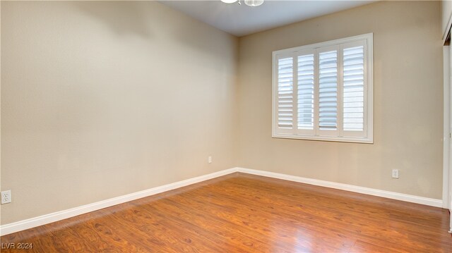 empty room with wood-type flooring