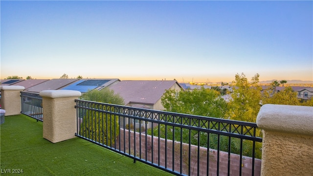 view of balcony at dusk