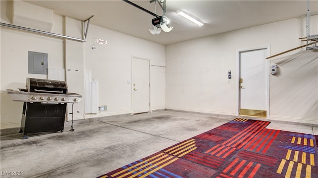 garage featuring electric panel and a garage door opener