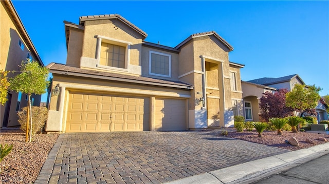 view of front of home with a garage