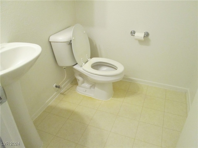 bathroom featuring tile patterned flooring and toilet