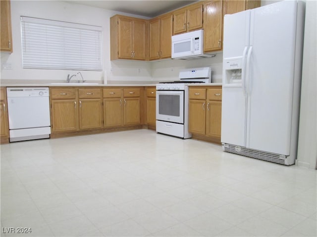 kitchen with white appliances and sink