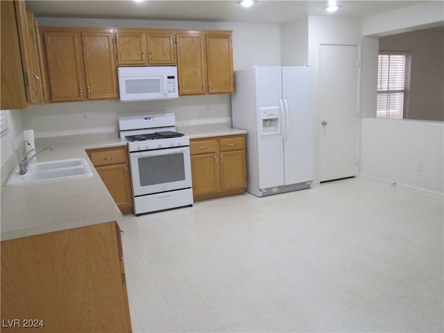 kitchen with white appliances and sink