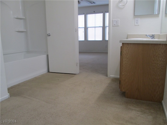 bathroom featuring vanity and washtub / shower combination