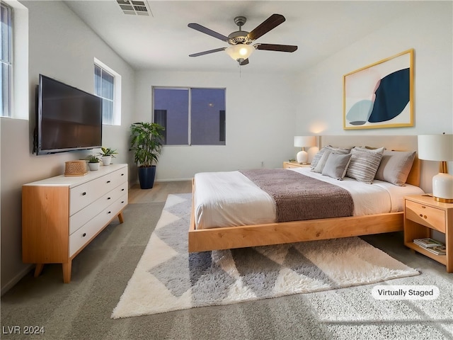 carpeted bedroom with ceiling fan