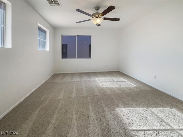 empty room with carpet flooring and ceiling fan