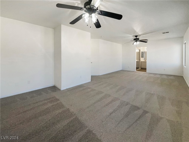 interior space with carpet flooring and ceiling fan