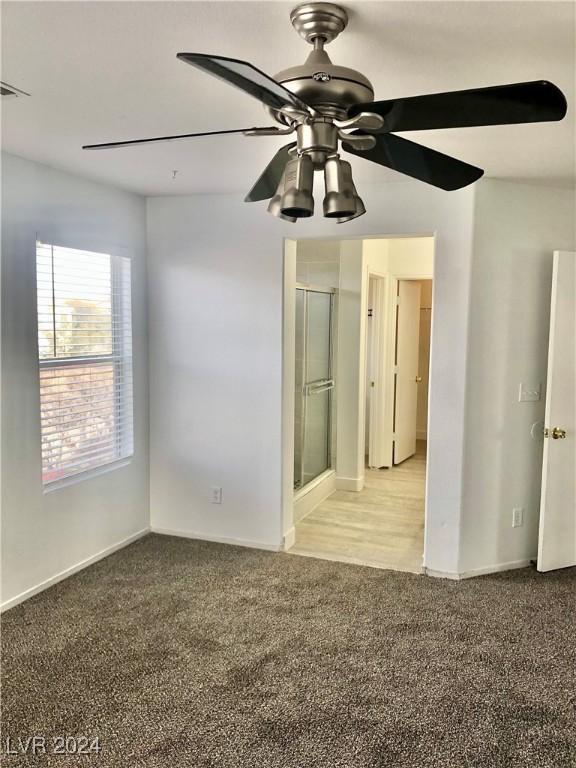 carpeted empty room with ceiling fan