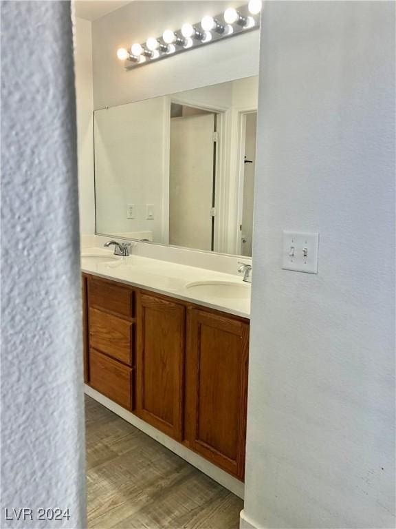 bathroom featuring vanity and wood-type flooring