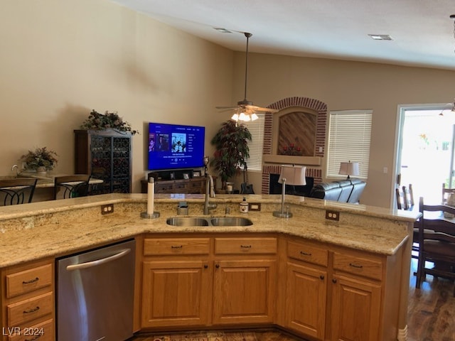 kitchen featuring ceiling fan, dishwasher, sink, dark hardwood / wood-style flooring, and lofted ceiling