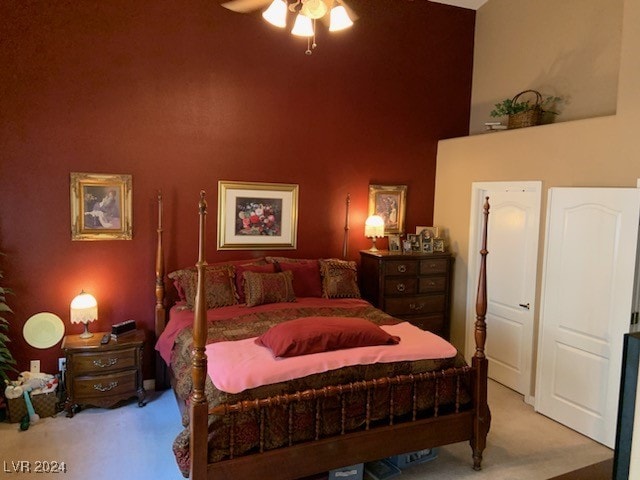 bedroom with ceiling fan and light colored carpet