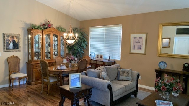 living room featuring hardwood / wood-style flooring and a notable chandelier