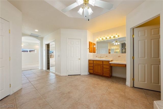 bathroom featuring vanity, tasteful backsplash, tile patterned floors, and ceiling fan