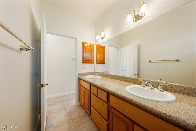 bathroom with tile patterned floors and vanity