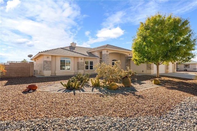 mediterranean / spanish-style home featuring a garage