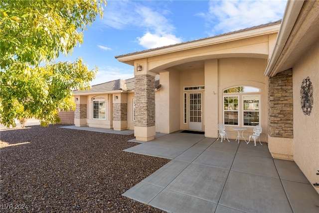 doorway to property featuring a patio