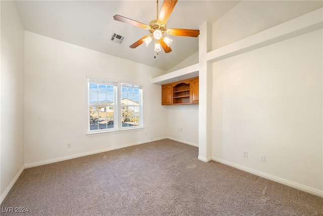 unfurnished room with ceiling fan, carpet floors, and vaulted ceiling