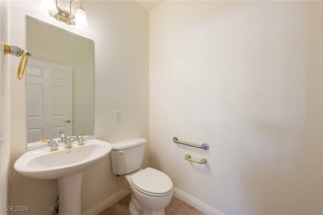 bathroom featuring tile patterned flooring and toilet