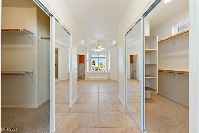 corridor featuring light colored carpet