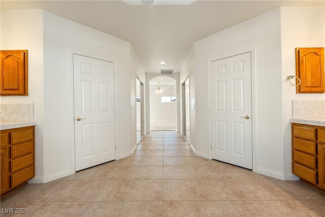 hallway with light tile patterned floors