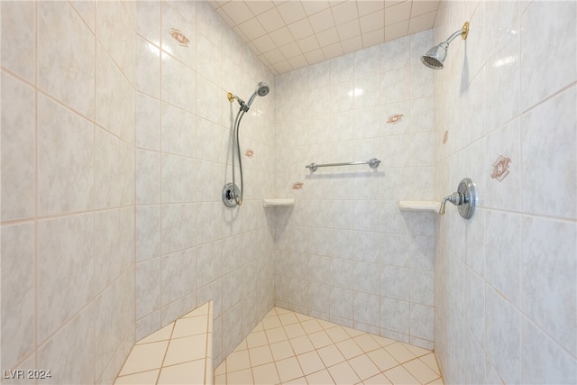 bathroom with tiled shower