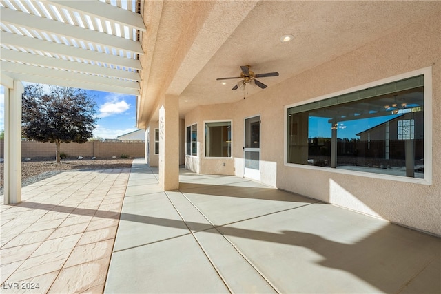 view of patio featuring ceiling fan